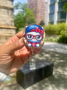 Hi Kitty Blue Hat Red Glasses Badge Reel